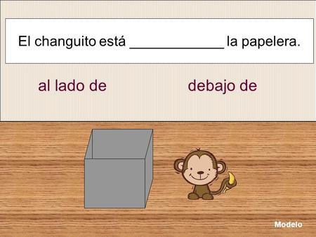 El changuito está ____________ la papelera.