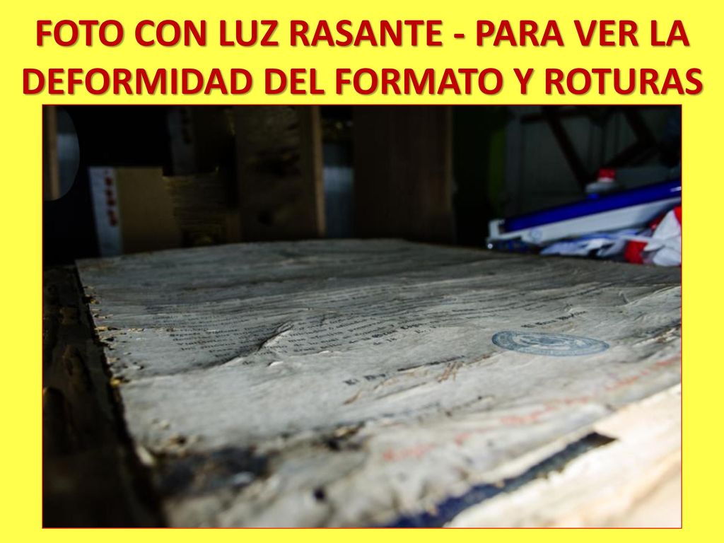 FOTO CON LUZ RASANTE - PARA VER LA DEFORMIDAD DEL FORMATO Y ROTURAS