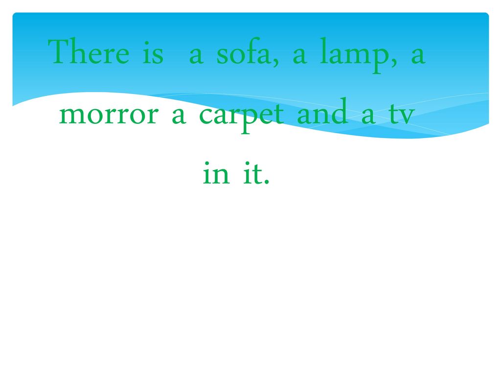 There is a sofa, a lamp, a morror a carpet and a tv in it.