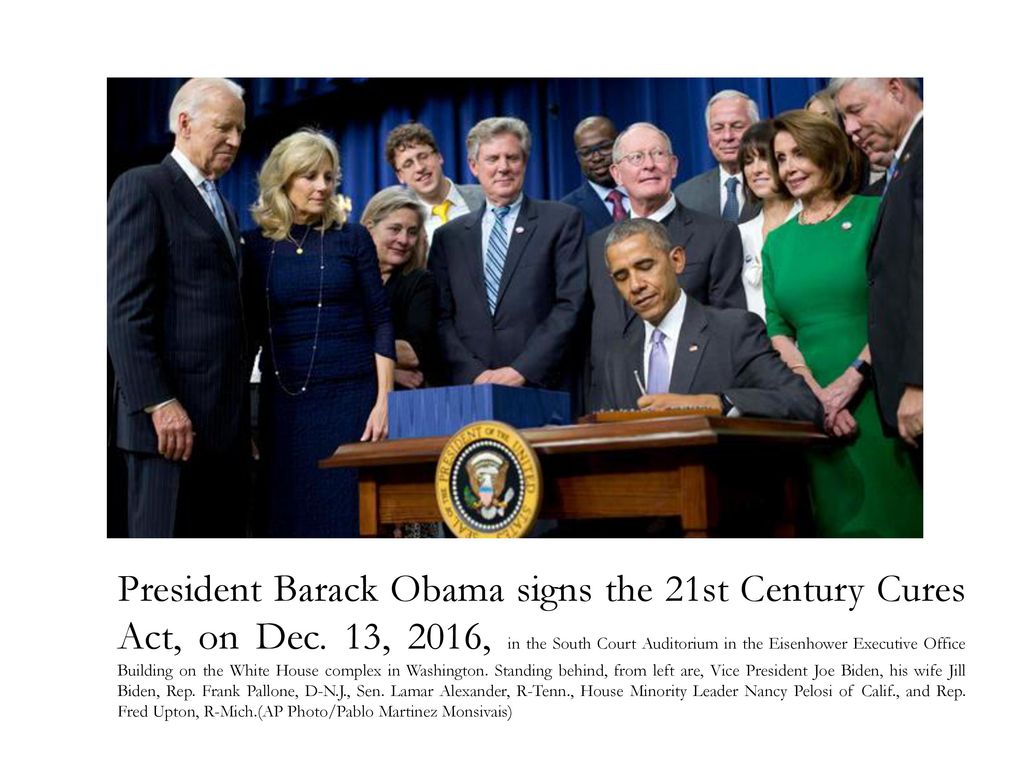 President Barack Obama signs the 21st Century Cures Act, on Dec