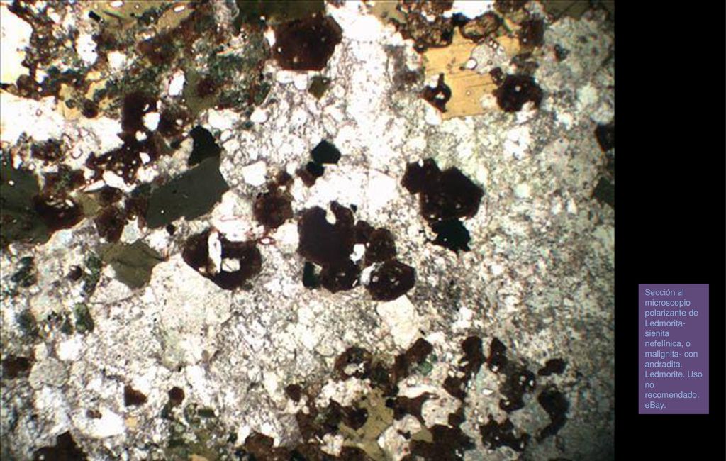 Sección al microscopio polarizante de Ledmorita- sienita nefelínica, o malignita- con andradita. Ledmorite. Uso no recomendado. eBay.