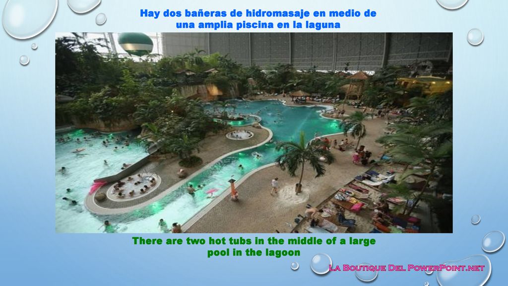 There are two hot tubs in the middle of a large pool in the lagoon