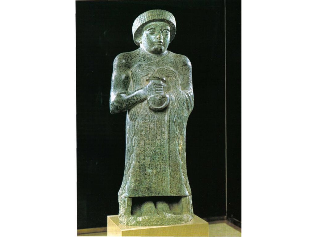 Patesi Gudea de Lagash sosteninedo el vaso manante. Diorita. Sumerio.