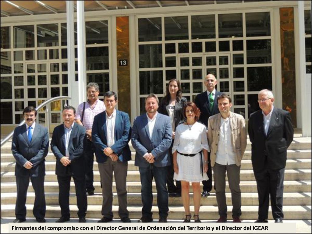 Firmantes del compromiso con el Director General de Ordenación del Territorio y el Director del IGEAR