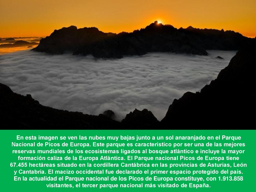 En esta imagen se ven las nubes muy bajas junto a un sol anaranjado en el Parque Nacional de Picos de Europa.