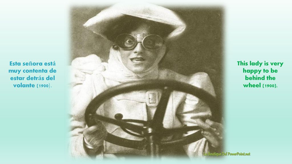 This lady is very happy to be behind the wheel (1900).
