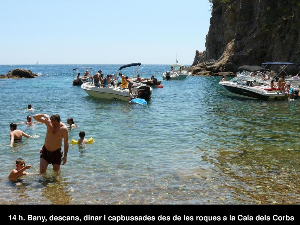 14 h. Bany, descans, dinar i capbussades des de les roques a la Cala dels Corbs