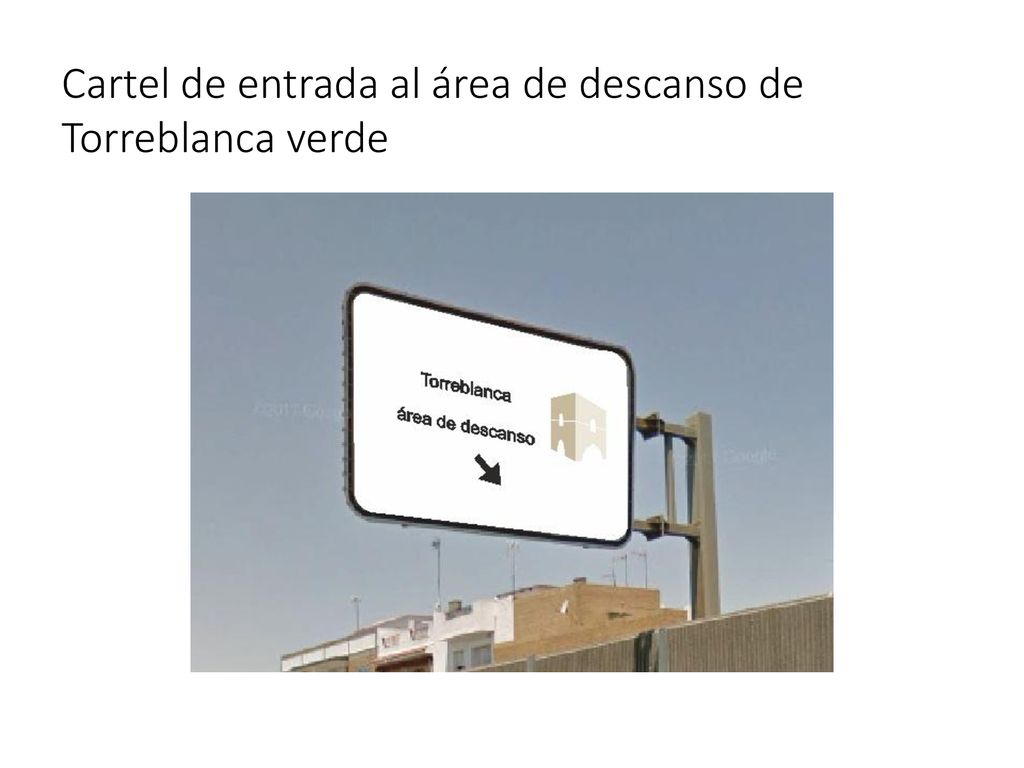 Cartel de entrada al área de descanso de Torreblanca verde