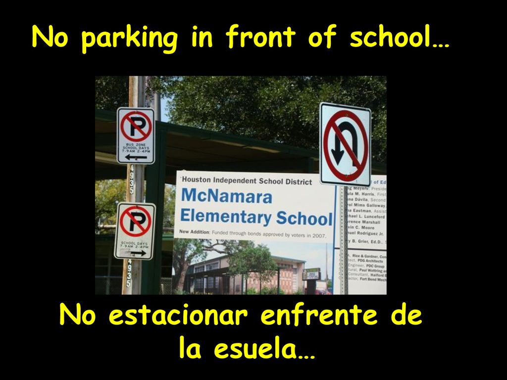 No parking in front of school… No estacionar enfrente de la esuela…