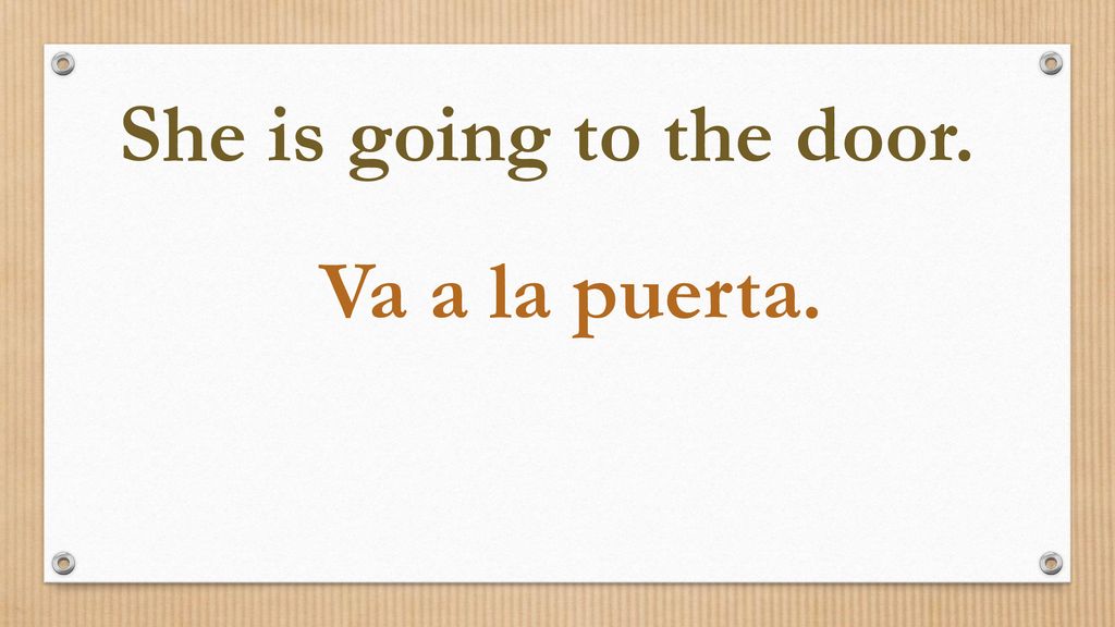 She is going to the door. Va a la puerta.