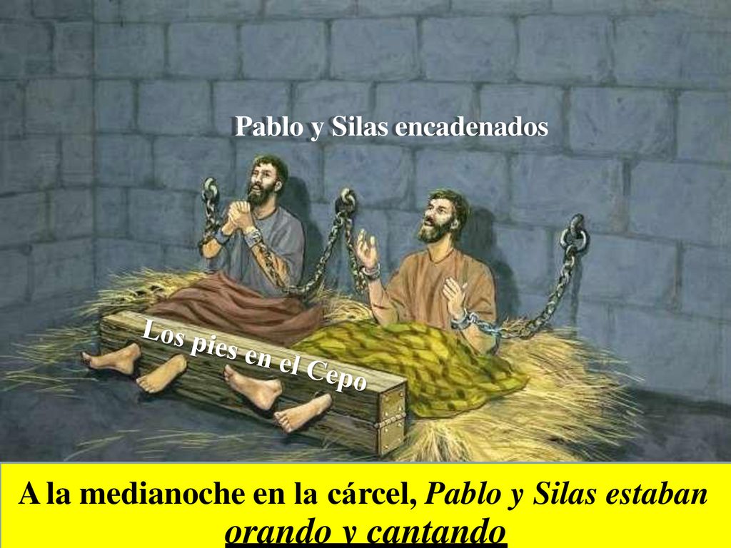 orando y cantando A la medianoche en la cárcel, Pablo y Silas estaban