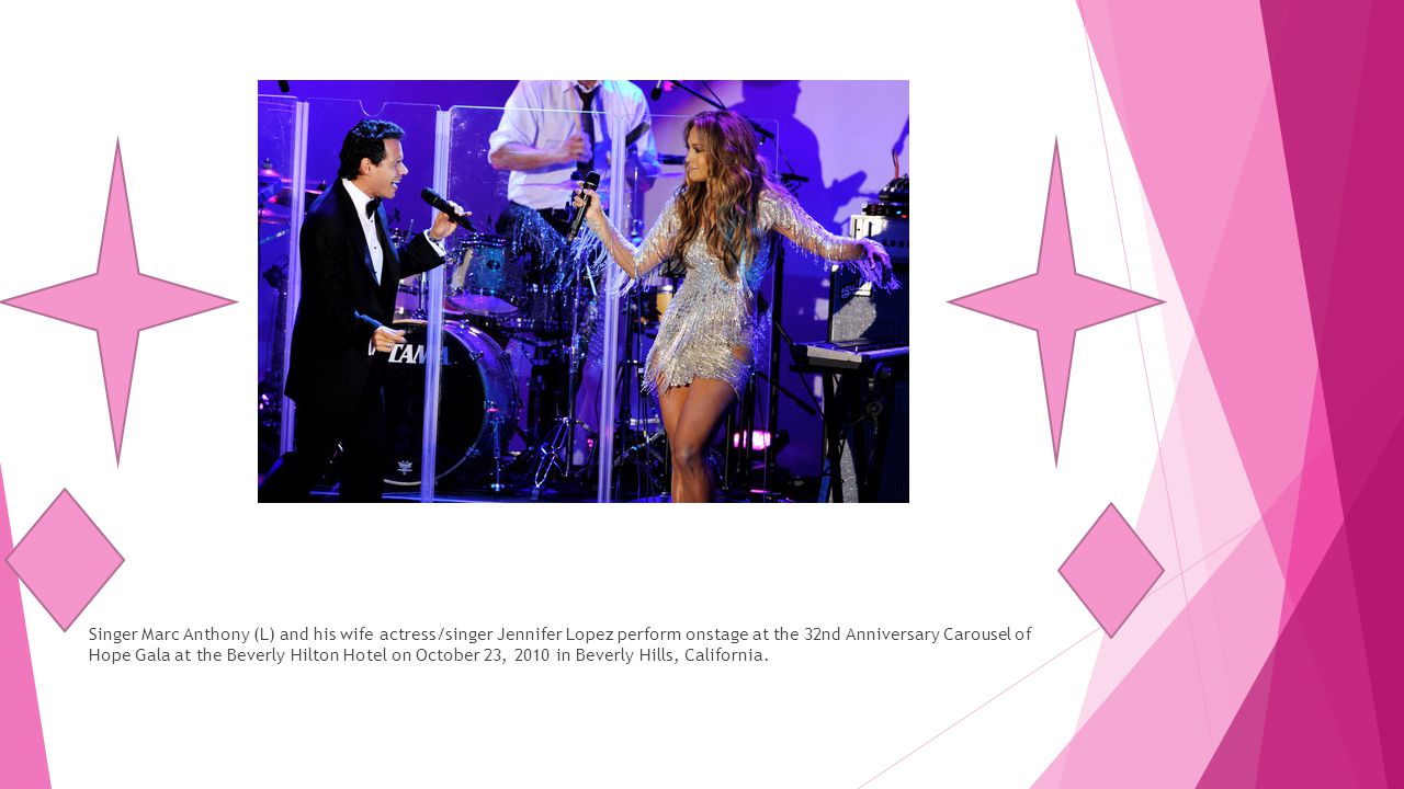 Singer Marc Anthony (L) and his wife actress/singer Jennifer Lopez perform onstage at the 32nd Anniversary Carousel of Hope Gala at the Beverly Hilton Hotel on October 23, 2010 in Beverly Hills, California.
