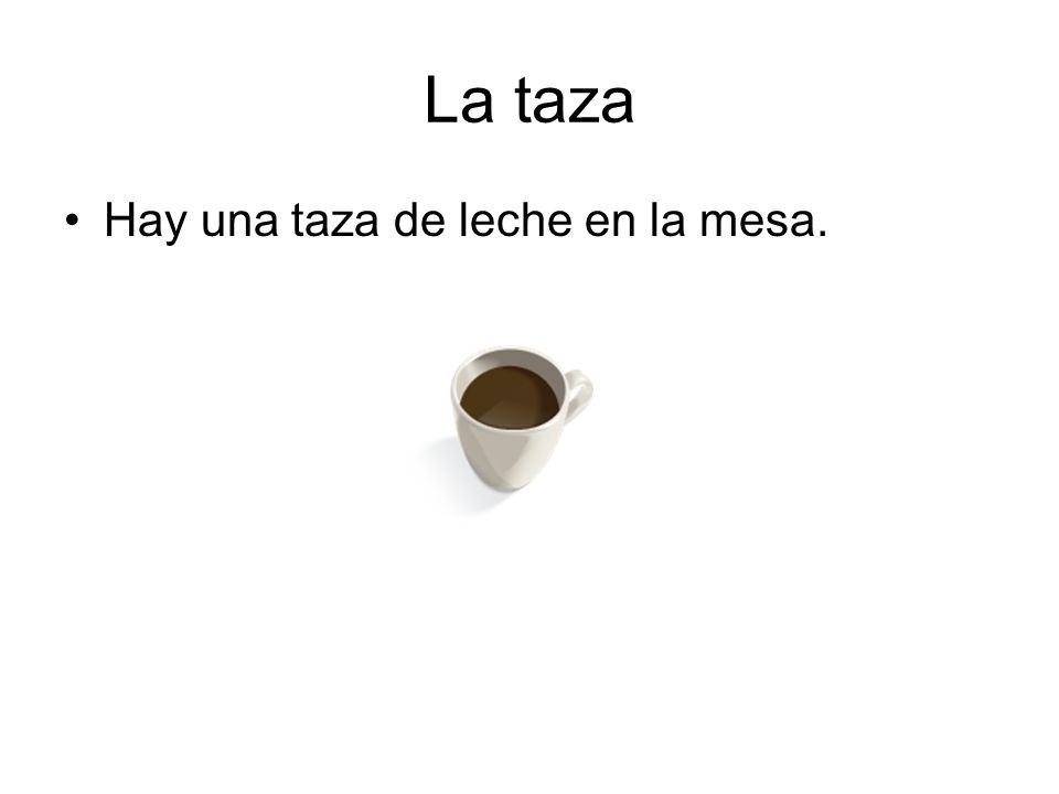 La taza Hay una taza de leche en la mesa.