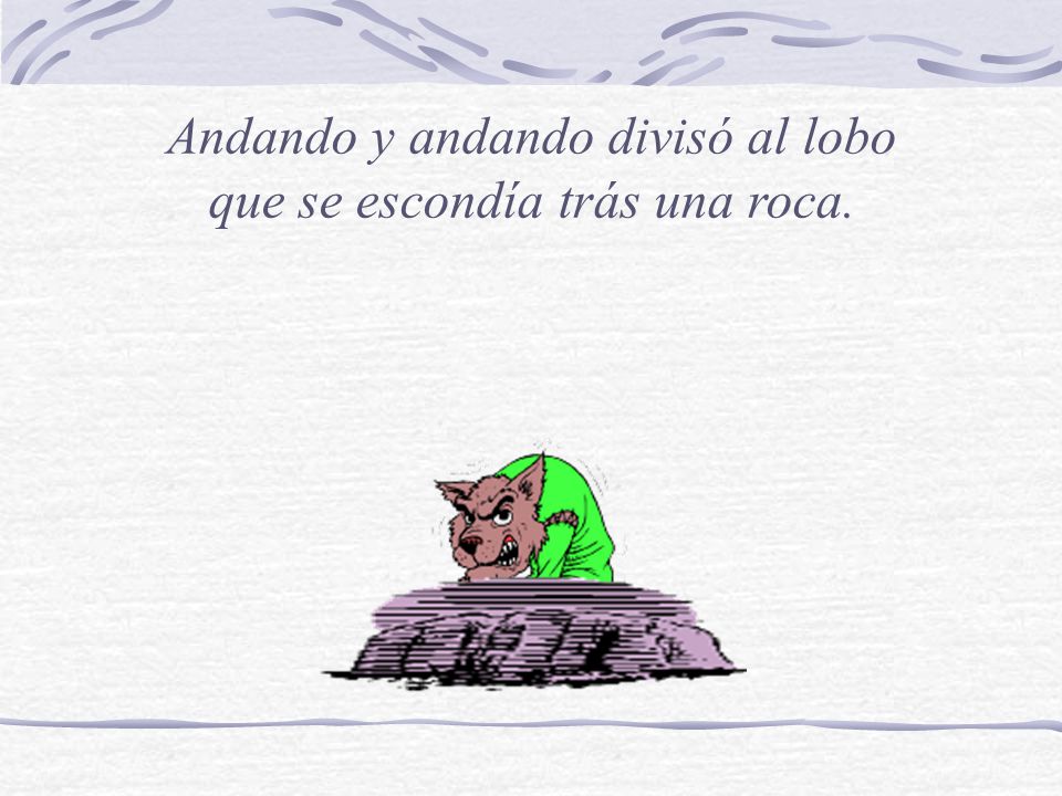 Andando y andando divisó al lobo que se escondía trás una roca.