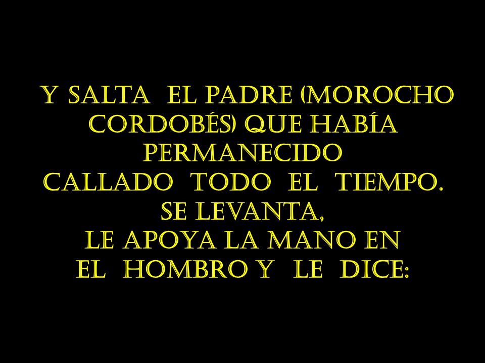 le apoya la mano en el hombro y le dice: