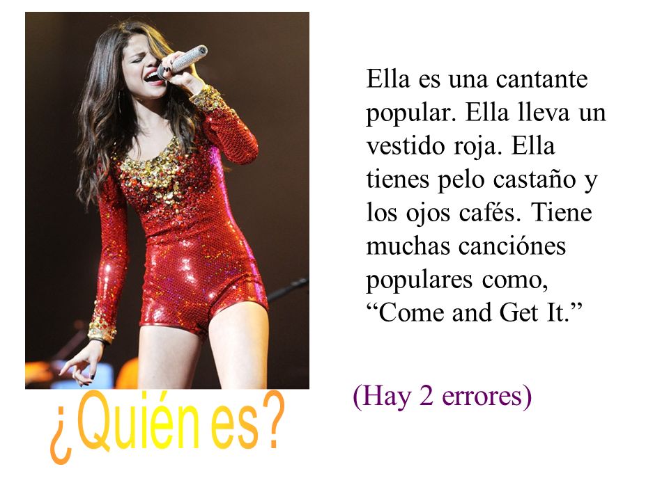 Ella es una cantante popular. Ella lleva un vestido roja